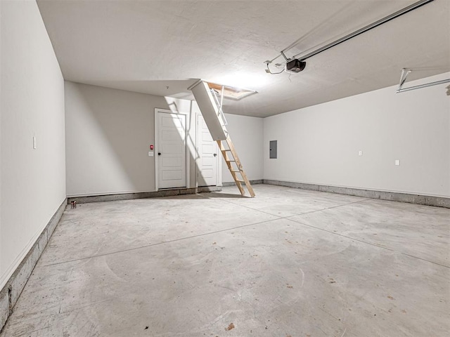 garage featuring electric panel and a garage door opener