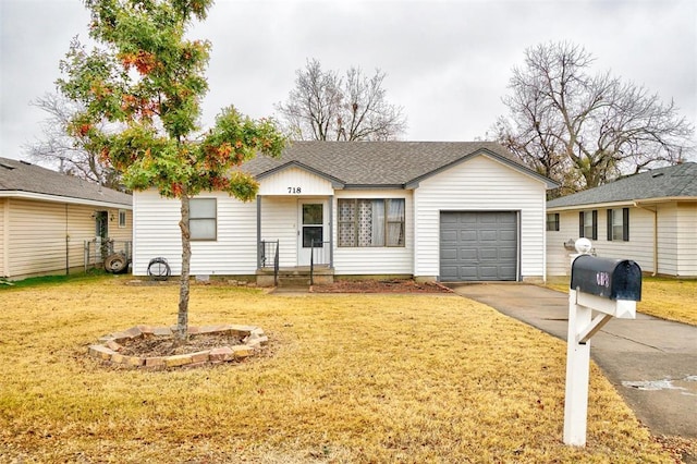 ranch-style house featuring a garage and a front yard