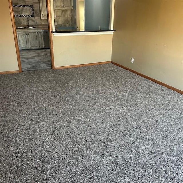 empty room with dark carpet