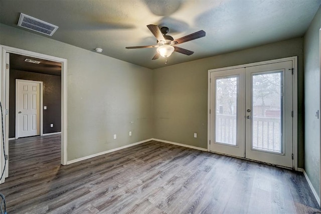 unfurnished room with ceiling fan, french doors, and light hardwood / wood-style flooring