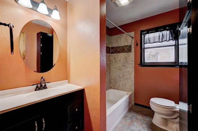 full bathroom with vanity, toilet, and tiled shower / bath combo