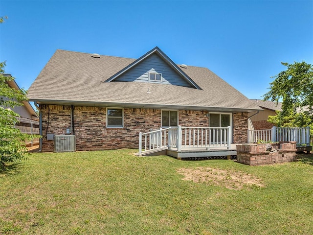 6404 Westway, Oklahoma City, OK 73142 - rear view of house with a wooden deck, roof with shingles, and brick siding