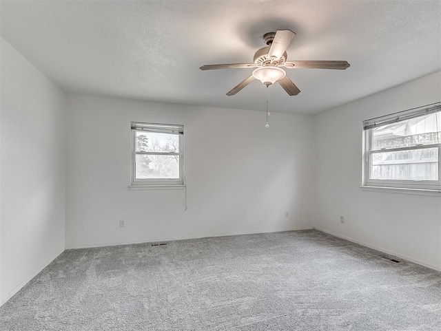 6404 Westway, Oklahoma City, OK 73142 - spare room featuring plenty of natural light, carpet, and ceiling fan