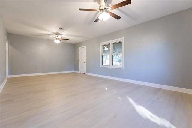 unfurnished room with ceiling fan and light wood-type flooring