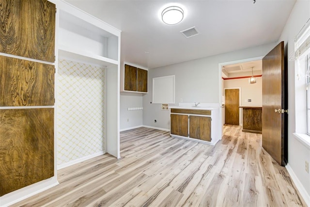 kitchen featuring sink and light hardwood / wood-style flooring