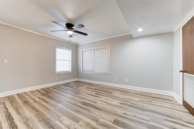 empty room featuring light wood-type flooring, ceiling fan, and crown molding