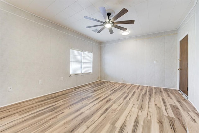 unfurnished room with ceiling fan and light hardwood / wood-style flooring