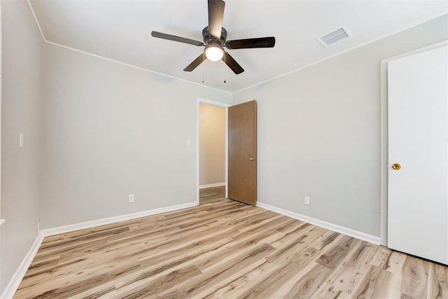 unfurnished room with ceiling fan and light hardwood / wood-style flooring