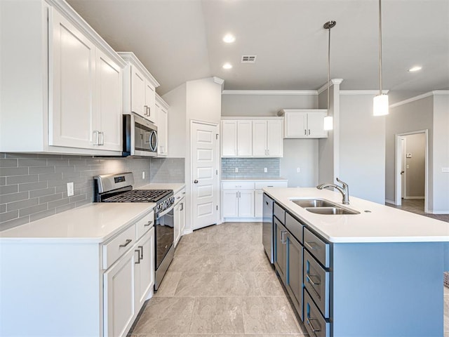 kitchen with white cabinets, sink, stainless steel appliances, and hanging light fixtures