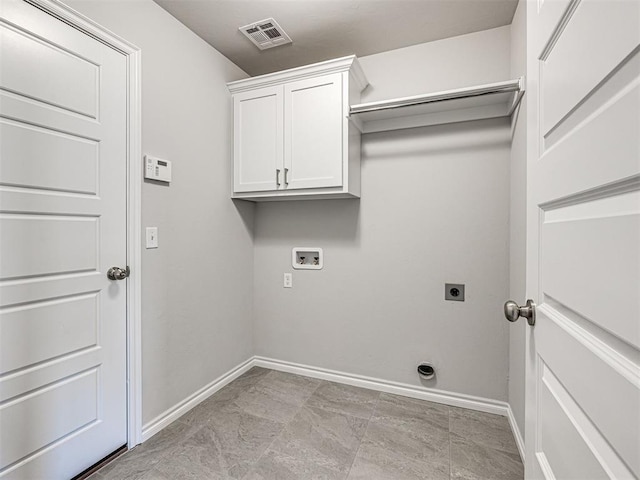 laundry area with electric dryer hookup, cabinets, and hookup for a washing machine