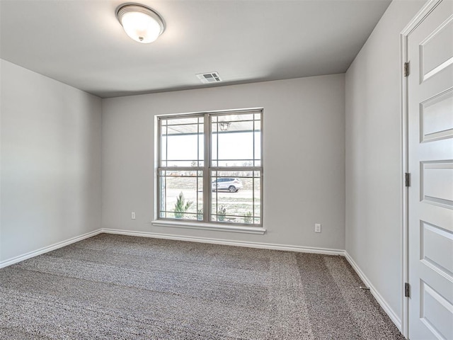 unfurnished room with carpet floors