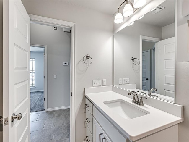 bathroom with tile patterned floors and vanity