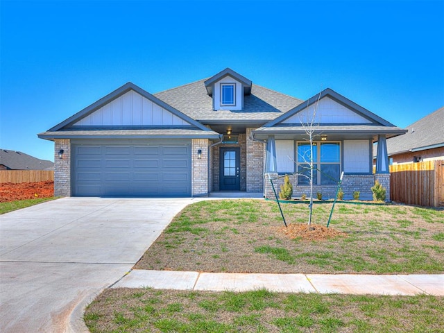 view of front facade featuring a front yard and a garage