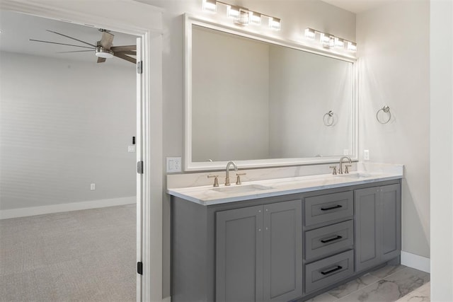 bathroom with ceiling fan and vanity