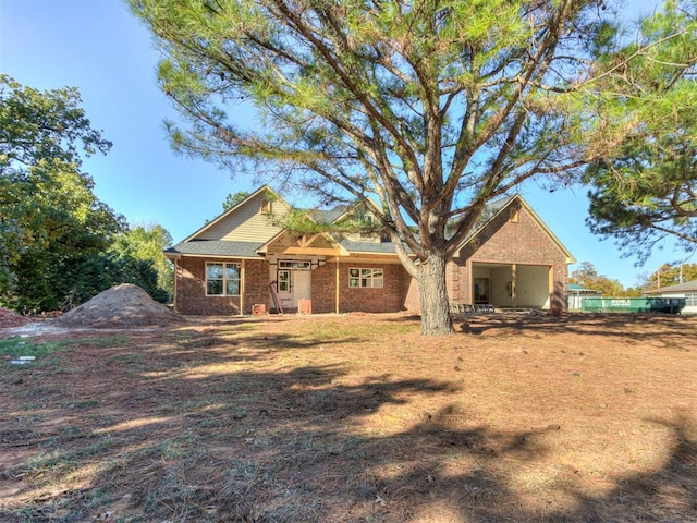 view of front of home with brick siding