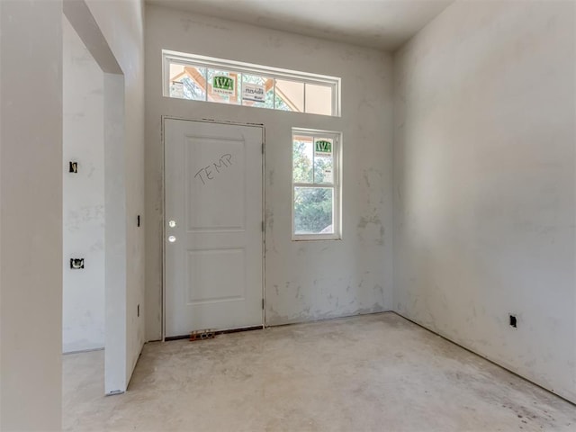 foyer featuring concrete flooring