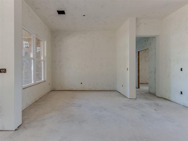 empty room with unfinished concrete floors