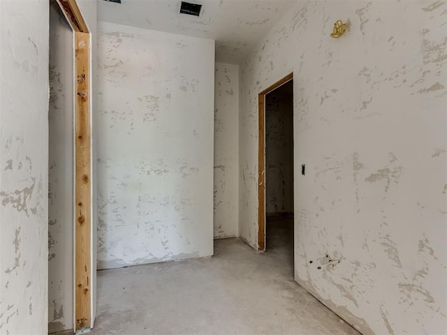 spare room with concrete flooring