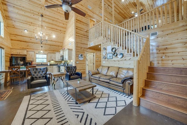 living room featuring high vaulted ceiling and concrete flooring