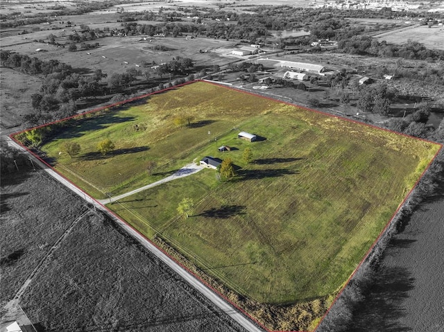 birds eye view of property featuring a rural view