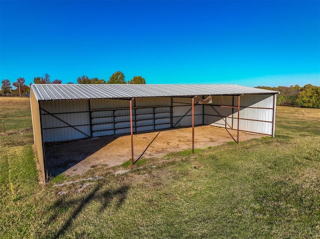 view of outdoor structure featuring a lawn