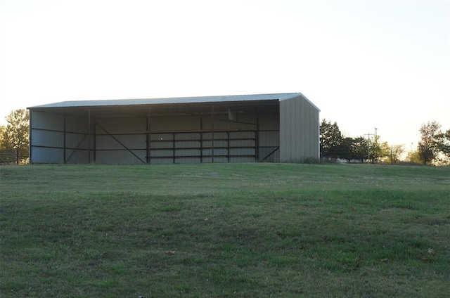 view of outbuilding with a yard