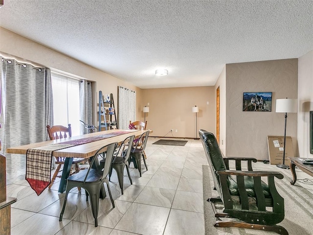 dining space with a textured ceiling