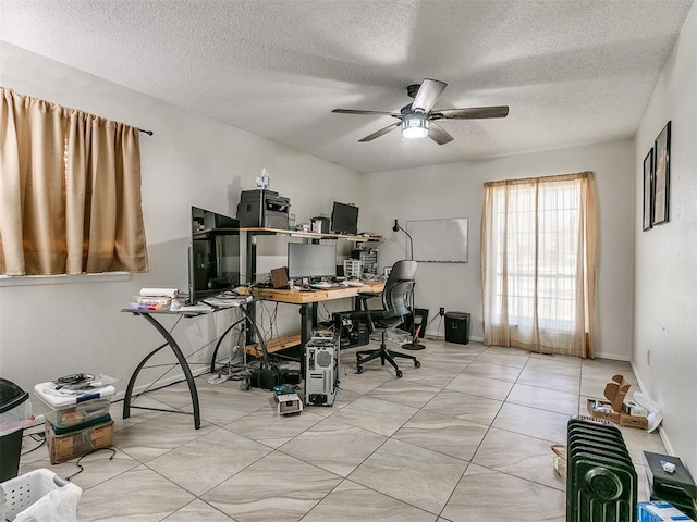 office area featuring ceiling fan and a textured ceiling