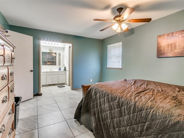 tiled bedroom with connected bathroom and ceiling fan