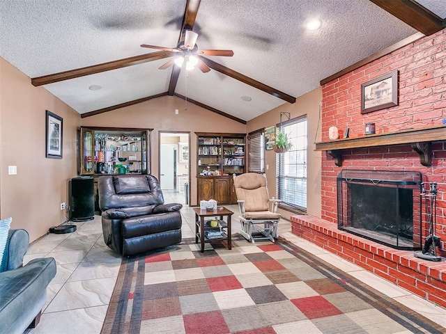 living room featuring ceiling fan, a fireplace, lofted ceiling with beams, and a textured ceiling