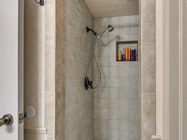 bathroom with tiled shower