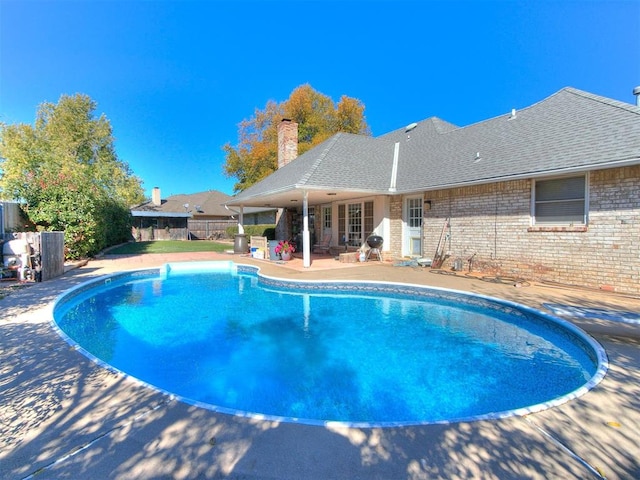 view of swimming pool featuring a patio area