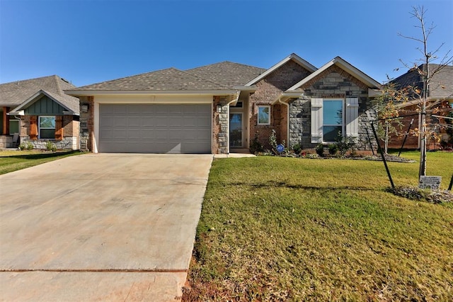 view of front of house featuring a front yard and a garage