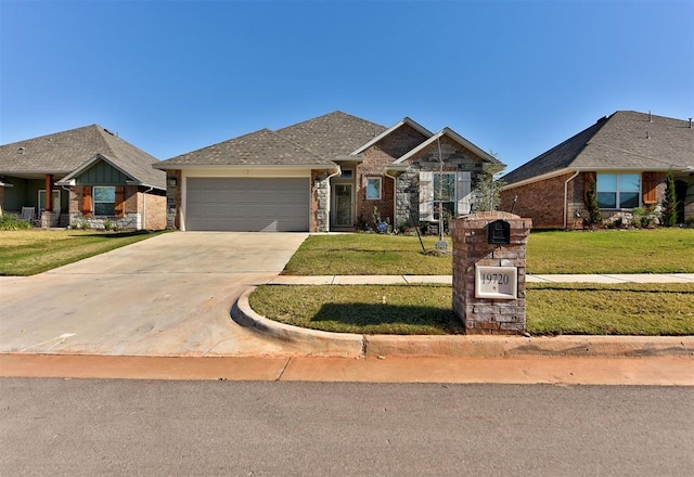 view of front of property with a garage and a front yard