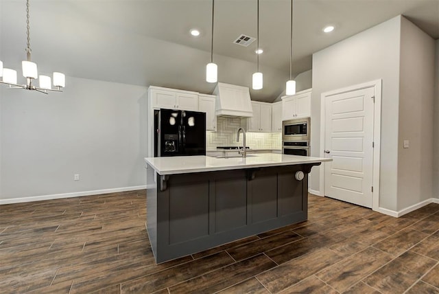 kitchen with dark hardwood / wood-style floors, white cabinetry, sink, and appliances with stainless steel finishes