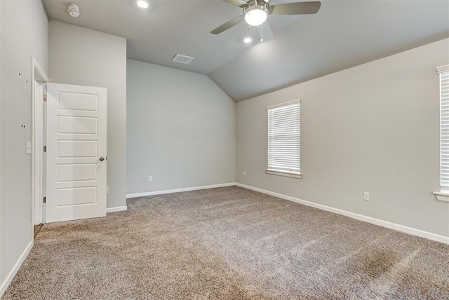 unfurnished room featuring carpet, ceiling fan, and lofted ceiling