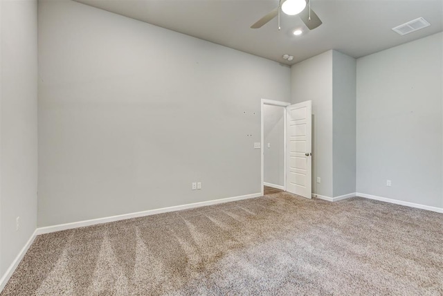 spare room with ceiling fan and carpet floors