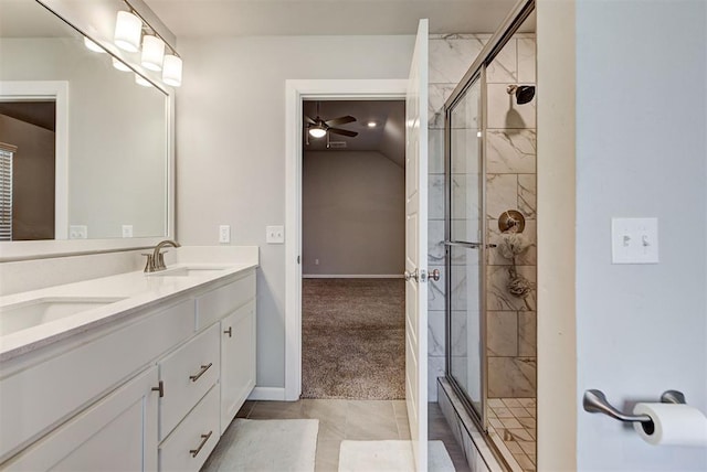 bathroom featuring ceiling fan, tile patterned flooring, vanity, and an enclosed shower