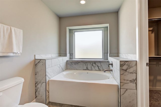 bathroom with a bathtub and toilet