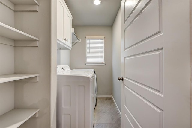 laundry room with cabinets and washing machine and dryer