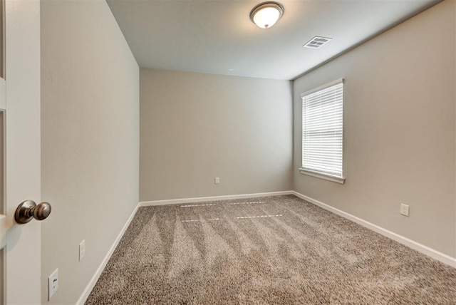 spare room featuring carpet flooring