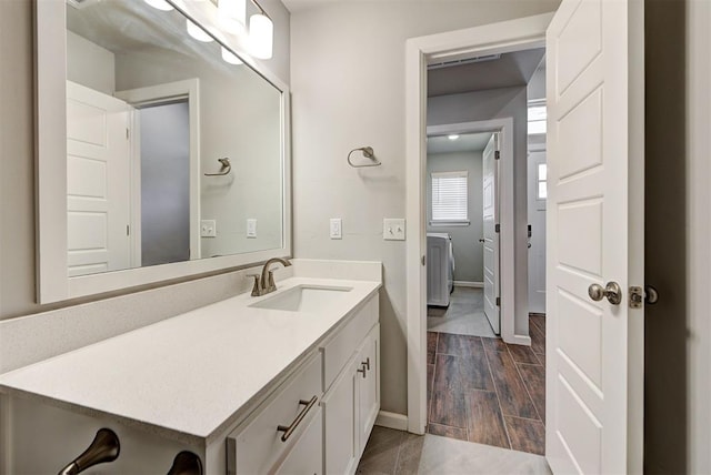 bathroom with vanity and wood-type flooring