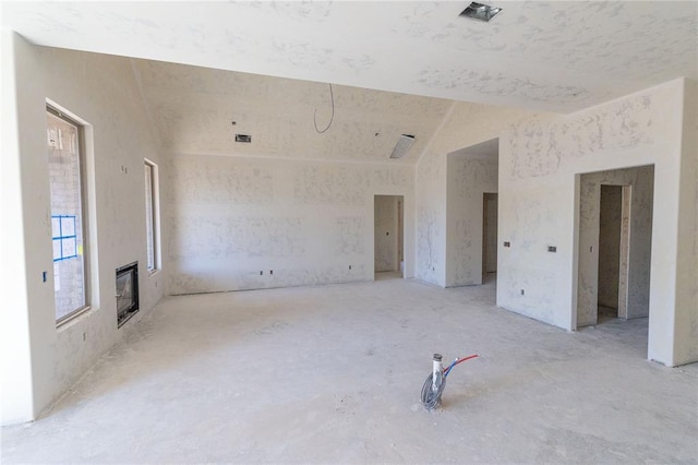 unfurnished room featuring a glass covered fireplace