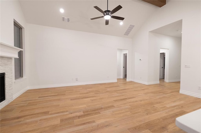 9216 NW 117th St, Yukon, OK 73099 - unfurnished living room featuring high vaulted ceiling, ceiling fan, a fireplace, light wood-style flooring, and baseboards