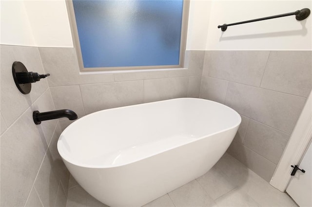 9216 NW 117th St, Yukon, OK 73099 - full bath featuring tile walls, a soaking tub, and tile patterned floors