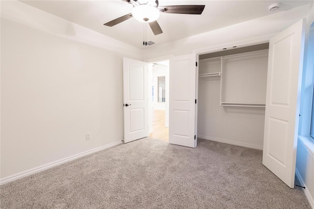 9216 NW 117th St, Yukon, OK 73099 - unfurnished bedroom with carpet flooring, a closet, baseboards, and a ceiling fan