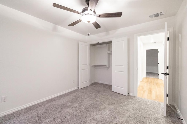 9216 NW 117th St, Yukon, OK 73099 - unfurnished bedroom featuring carpet floors, baseboards, a ceiling fan, and a closet
