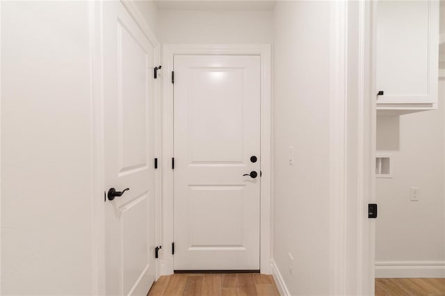 9216 NW 117th St, Yukon, OK 73099 - doorway with light wood finished floors and baseboards
