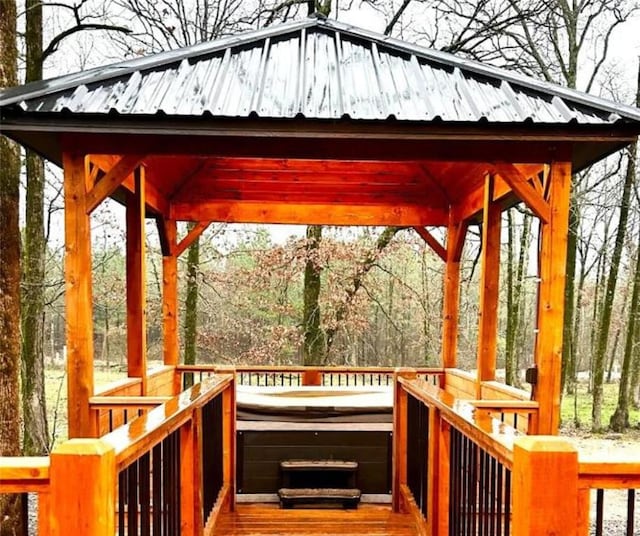 wooden terrace featuring a gazebo