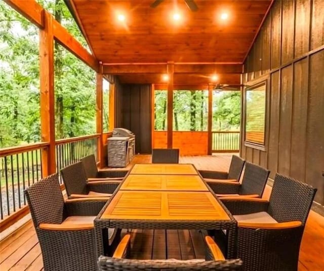 sunroom / solarium with wooden ceiling and vaulted ceiling